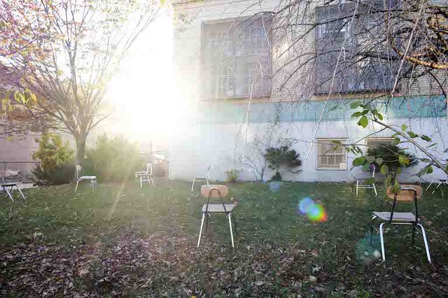 Empty student's chairs are seen in a yard outside of a public school in Brooklyn in November 2020.